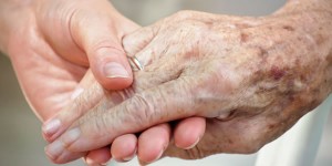 elderly hand in hand